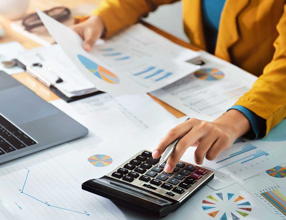 Accountant working on a calculator